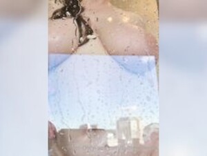 Submissivelia in the shower soaping her big tits