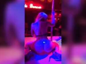 Nicolette Shea pole dancing in a go-go club