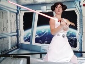Masha plays with a lightsaber