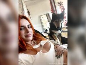 Bella Thorne trying on white outfit braless