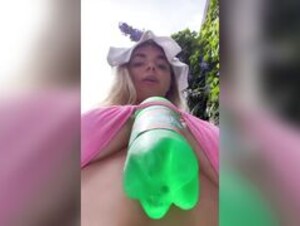 Anneth Dimitrieva with a bottle in her boobs
