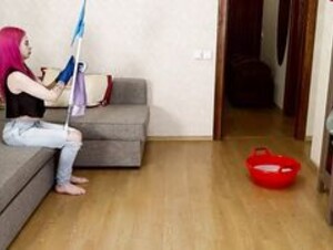 Maggie Fox mopping floor in see-through blouse