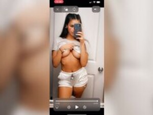 Genna Barton teasing her boobs on TikTok