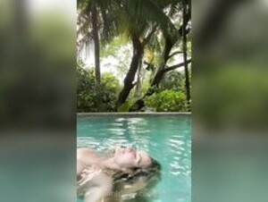 Allisonnyc floating in pool